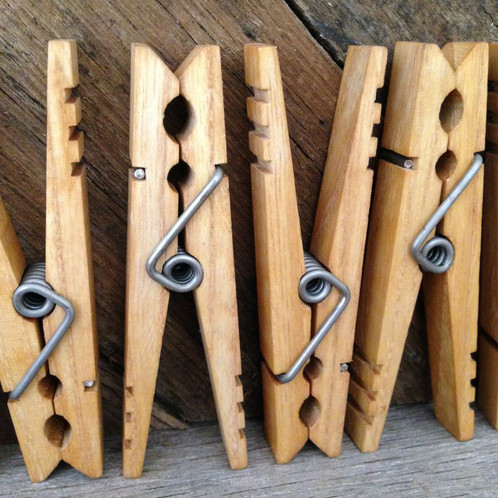 Clothespin collection. Empty wooden clothes pegs, laundry cord and